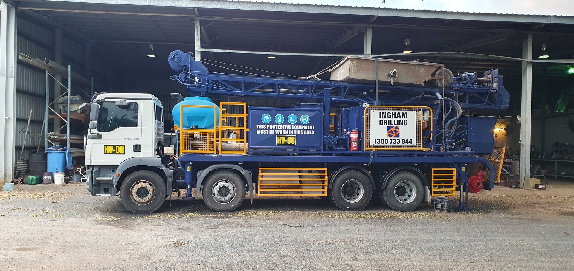 Mobile B80 drill rig HV-08 on a MAN TGM 8x4, side view in the workshop